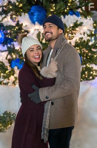 Tyler Hynes and Janel Parrish in Never Been Chris'd (2023)