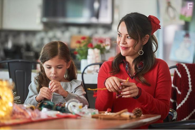 Janel Parrish and Piper Rubio in Holly & Ivy (2020)