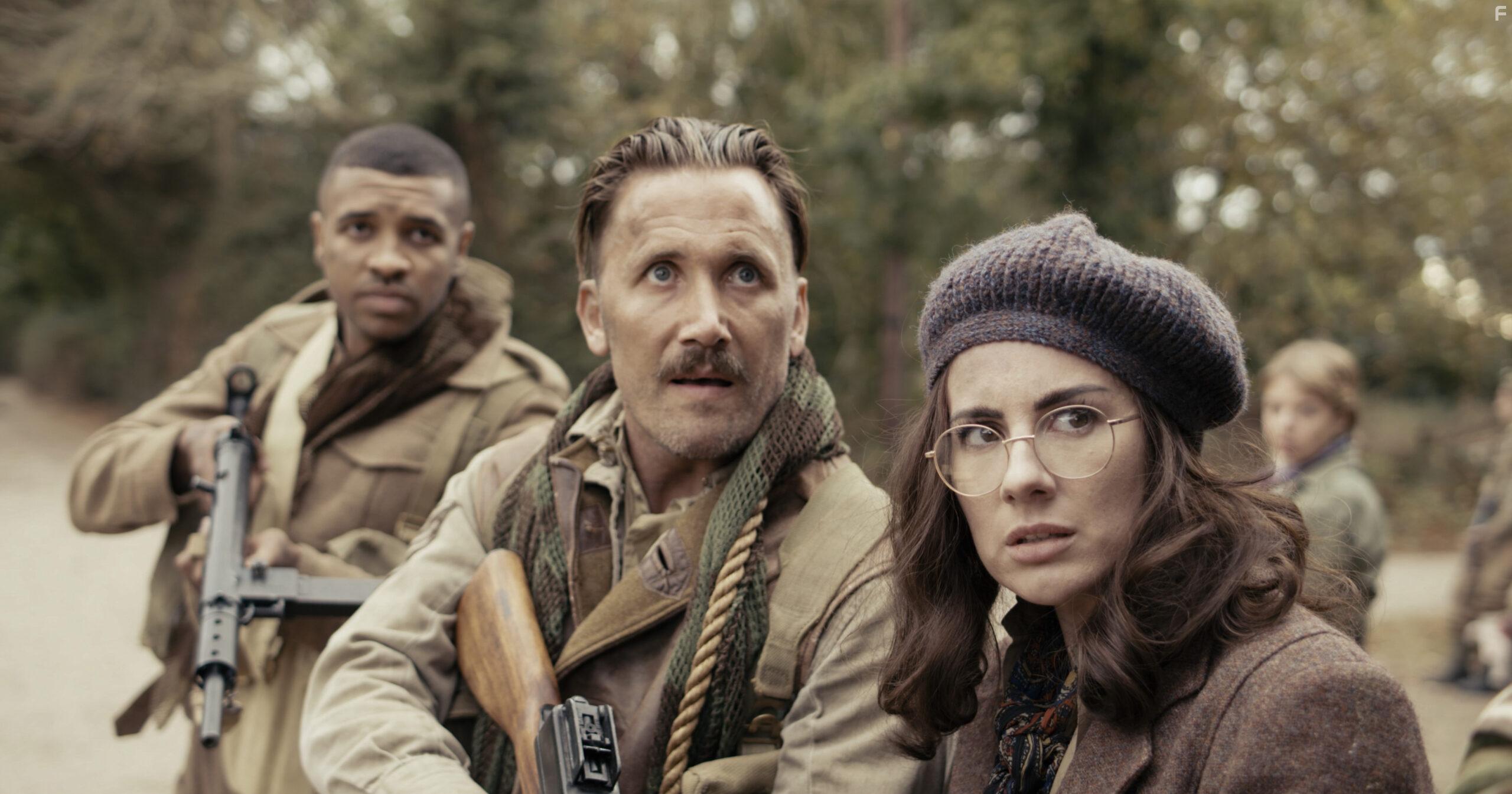 Bob Cryer, Asan N'Jie, and Sophie Craig in Fortunes of War (2024)