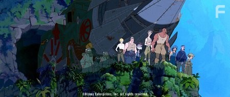 A team of explorers, including (left to right) Helga, Moliere, Commander Rourke, Cookie, Milo Thatch, Dr. Sweet, Audrey, Vinny, and Mrs. Packard, stand on the brink of a startling discovery when they journey through a crevice in the ocean floor to reach a lost civilization.