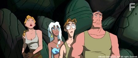 Princess Kida (second from left), the daughter of the Atlantean king, and a team of explorers from the surface -- Commander Rourke (right), cartographer Milo Thatch (second from right), and Lieutenant Helga Sinclair (left) -- discover a secret crystal chamber beneath the city.