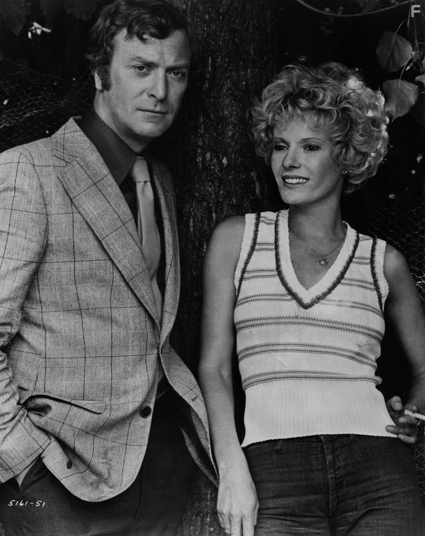 Michael Caine and Delphine Seyrig in Черная мельница (1974)