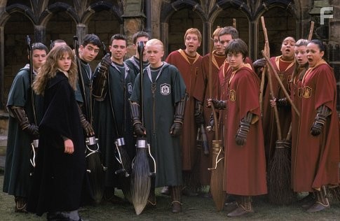 Hermione Granger (EMMA WATSON, left) joins the Quidditch players including Draco Malfoy (TOM FELTON, center) and Harry Potter (DANIEL RADCLIFFE).
