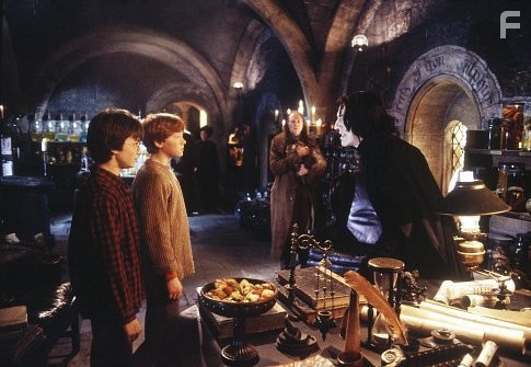 (L-r) Harry (DANIEL RADCLIFFE), Ron (RUPERT GRINT),  Filch (DAVID BRADLEY) and Professor Snape (ALAN RICKMAN).