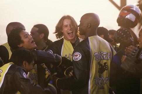 The Biker Boyz, including Flip (DION BASCO, front left), Philly (DANTE BASCO, left) and Stuntman (BRENDAN FEHR, center), congratulate their leader Kid (DEREK LUKE) on the race of his life.
