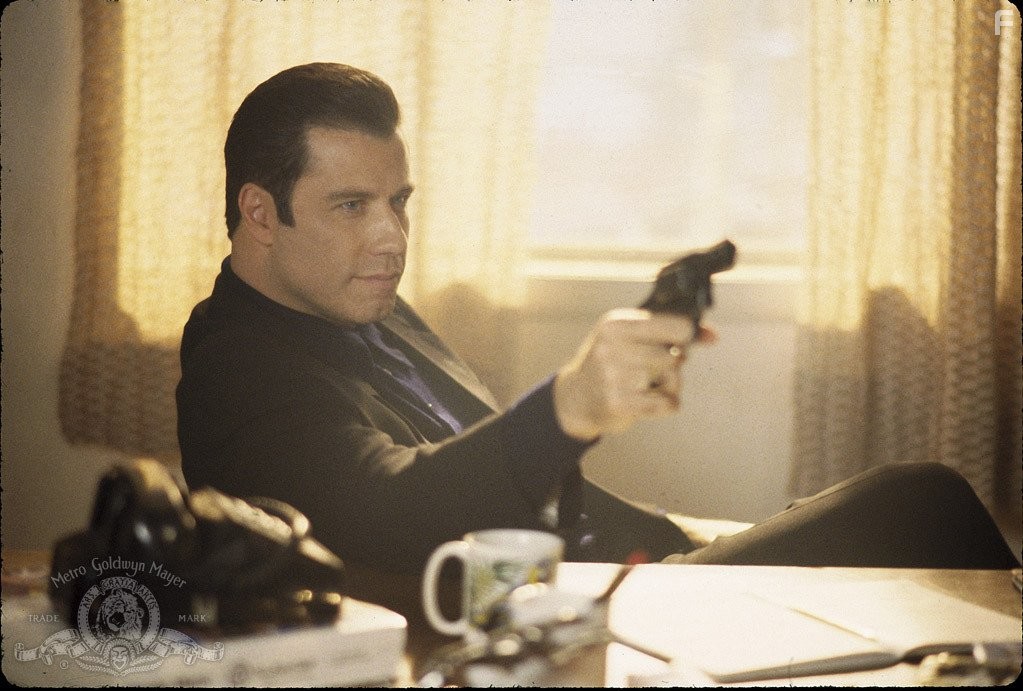 John Travolta in Достать коротышку (1995)