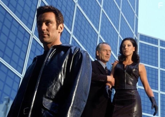 Andrea Parker and Michael T. Weiss in Притворщик (1996)