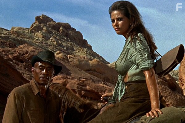 Claudia Cardinale and Woody Strode in Профессионалы (1966)