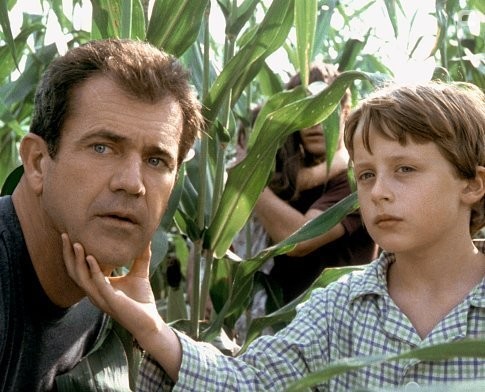 Morgan Hess (Rory Culkin, right) shows his father, Graham (Mel Gibson, left) what's going on.