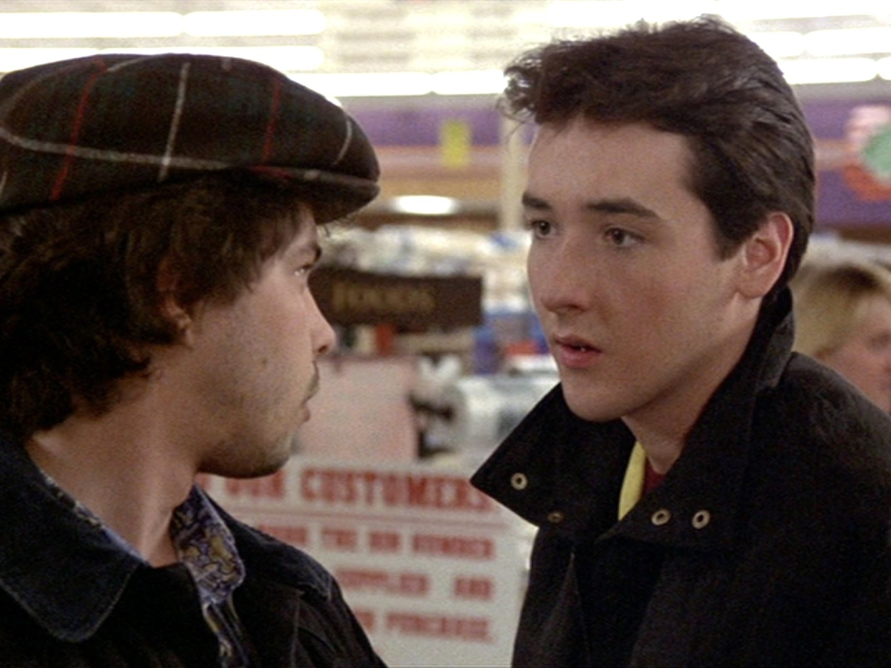 John Cusack and Curtis Armstrong in Уж лучше умереть (1985)