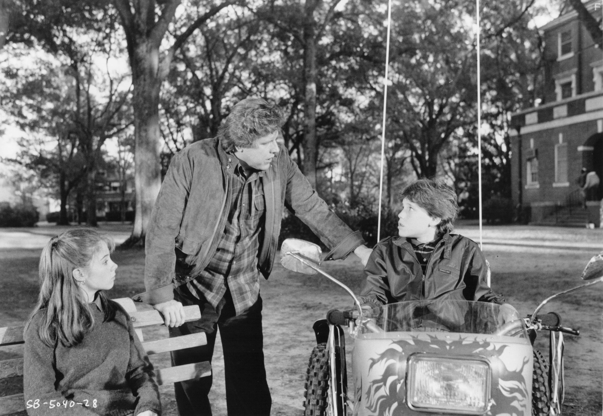 Corey Haim, Gary Busey, and Megan Follows in Серебряная пуля (1985)