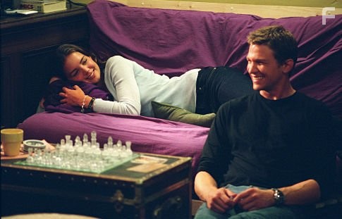 Samantha (Katie Holmes) and college beau James (Marc Blucas) enjoy a rare quiet moment.
