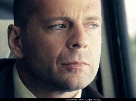 Bruce Willis, starring as David Dunn, on the train that will change his life - Photo Credit: Frank Masi. S.M.P.S.P.