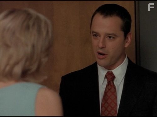Gil Bellows and Courtney Thorne-Smith in Элли МакБил (1997)