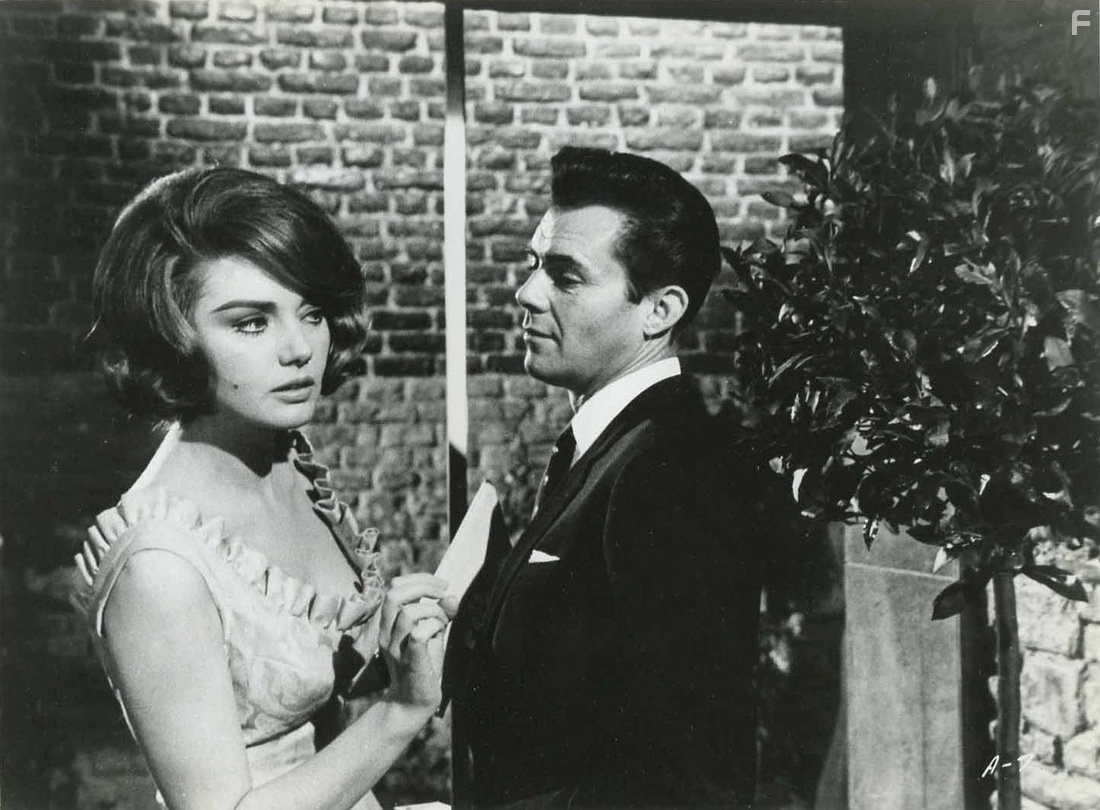 Dirk Bogarde and Sylva Koscina in Hot Enough for June (1964)