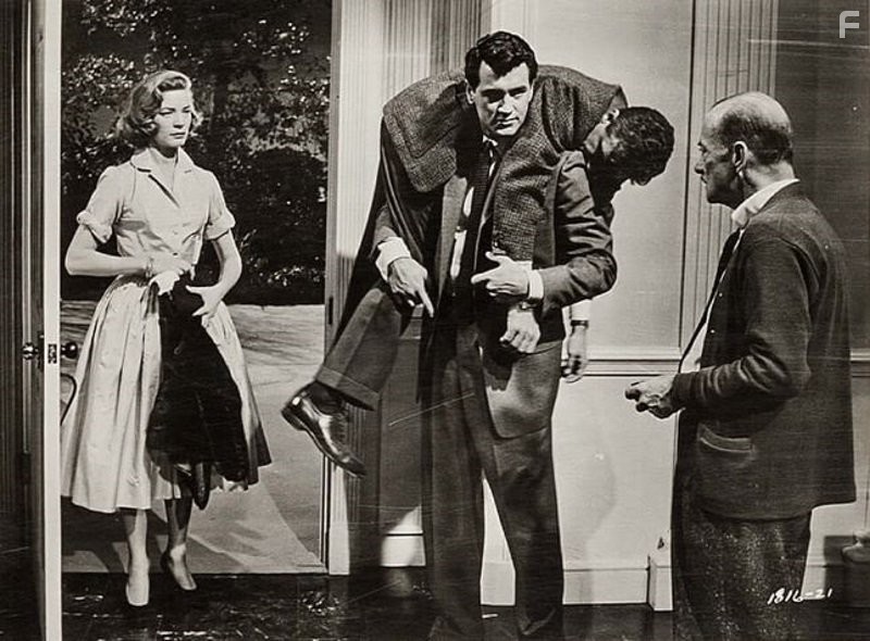 Lauren Bacall and Rock Hudson in Слова, написанные на ветру (1956)