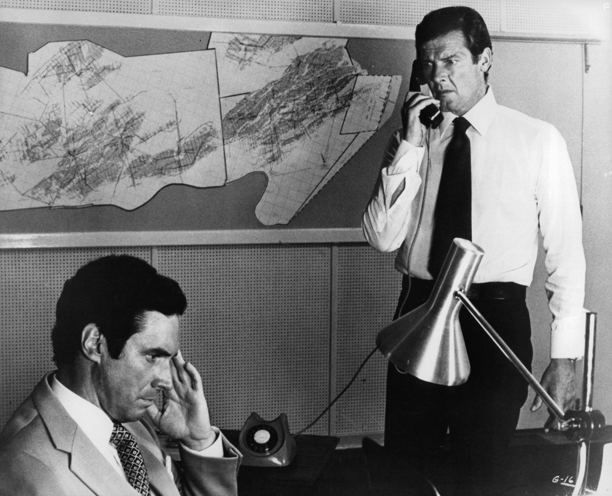 Roger Moore and Bradford Dillman in Gold (1974)