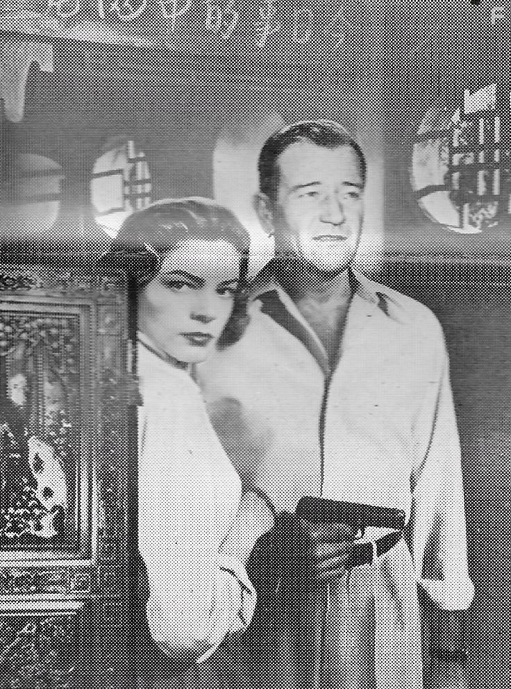 Lauren Bacall and John Wayne in Кровавая аллея (1955)