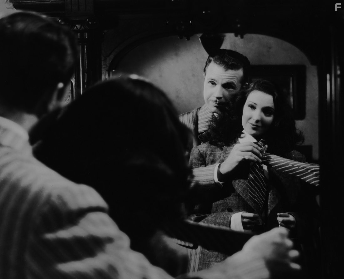 Linda Darnell and Dick Powell in It Happened Tomorrow (1944)