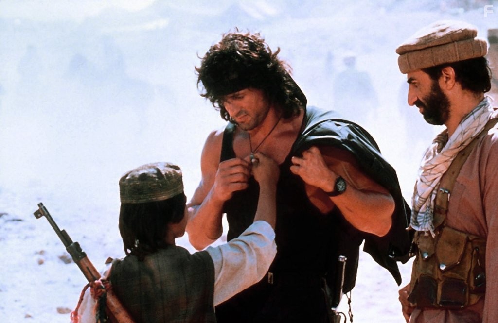 Sylvester Stallone, Sasson Gabai, and Doudi Shoua in Рэмбо 3 (1988)