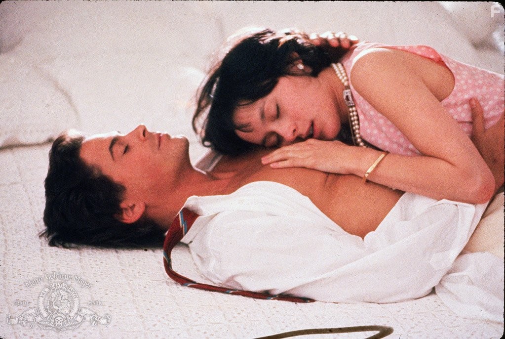 Rob Lowe and Meg Tilly in Маскарад (1988)