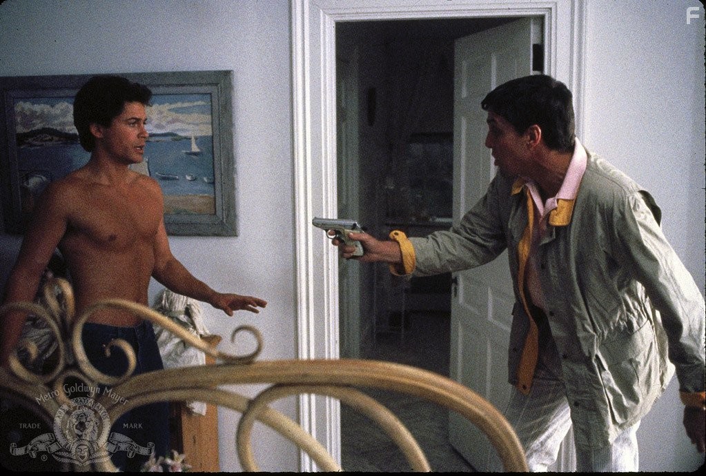 Rob Lowe and John Glover in Маскарад (1988)