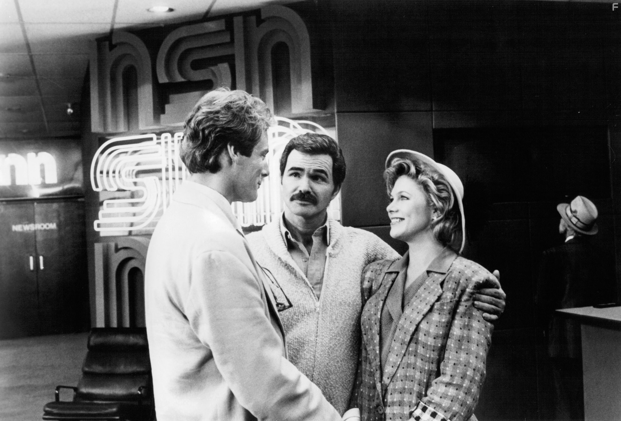 Burt Reynolds, Kathleen Turner, and Christopher Reeve in Переключая каналы (1988)