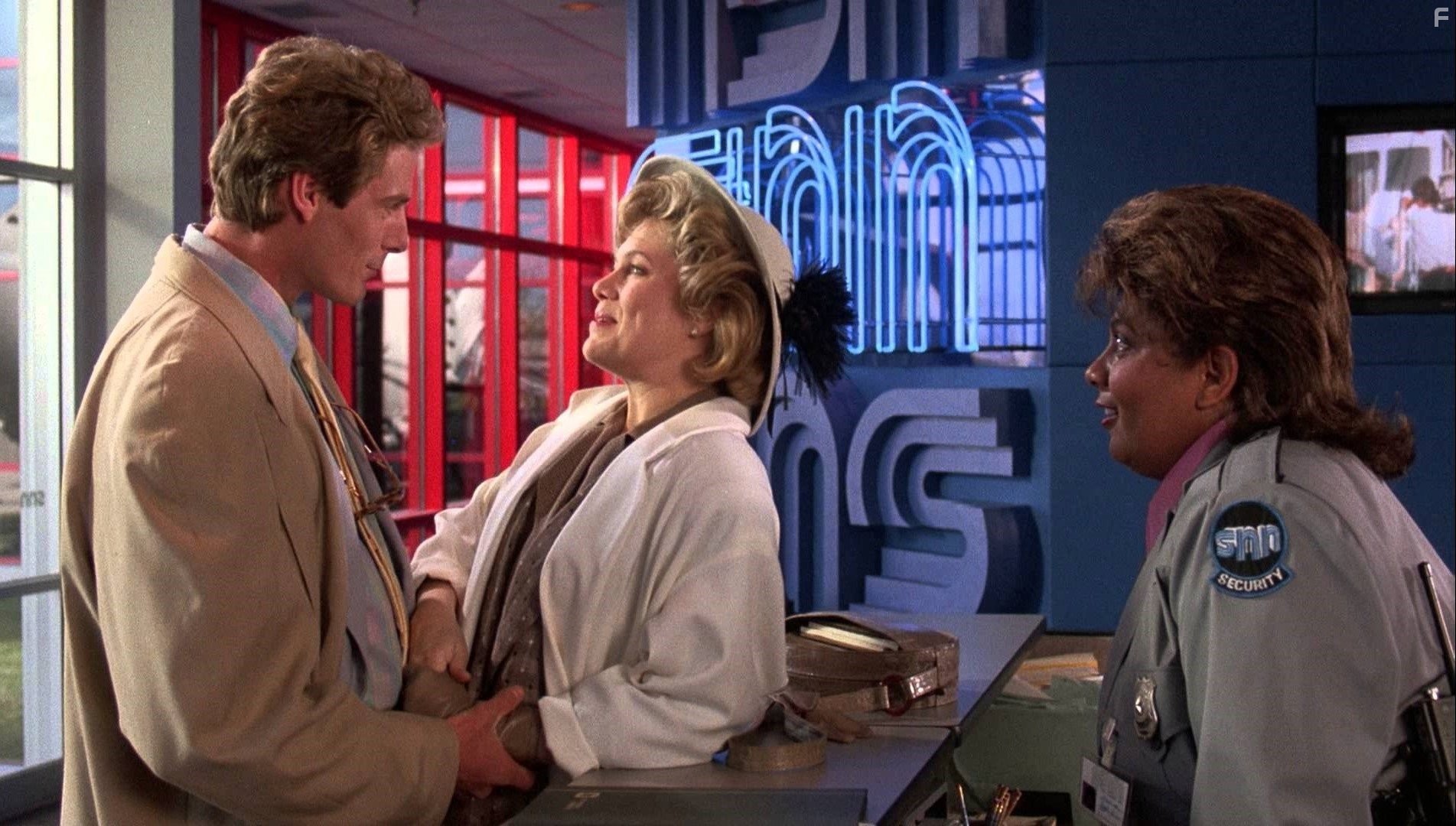 Kathleen Turner and Christopher Reeve in Переключая каналы (1988)