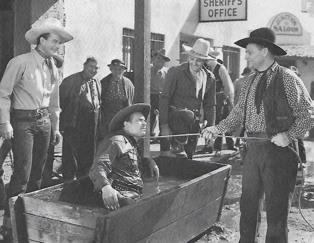 John Wayne, Richard Alexander, Ray Corrigan, and Max Terhune in Santa Fe Stampede (1938)