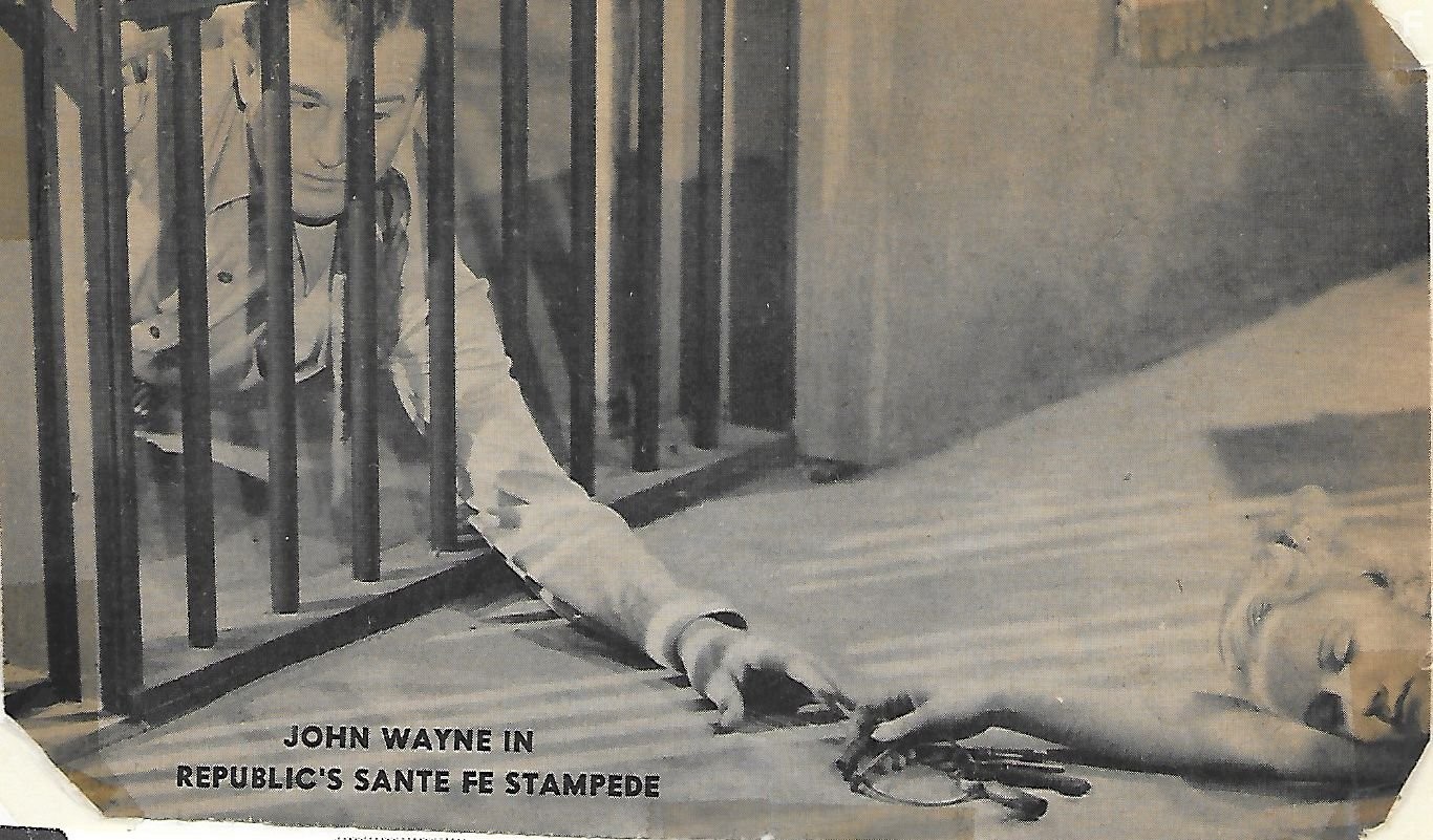 John Wayne and June Martel in Santa Fe Stampede (1938)