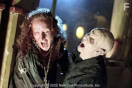 Priest (Tony Curran, left) attempts to fight off a Reaper in New Line Cinema's action thriller, BLADE II.