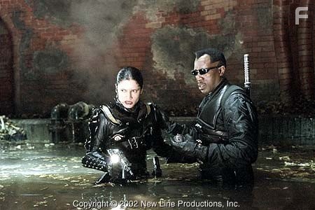 Nyssa (Leonor Varela, left) and Blade (Wesley Snipes) trapped in the tunnels of New Line Cinema's action thriller, BLADE II.