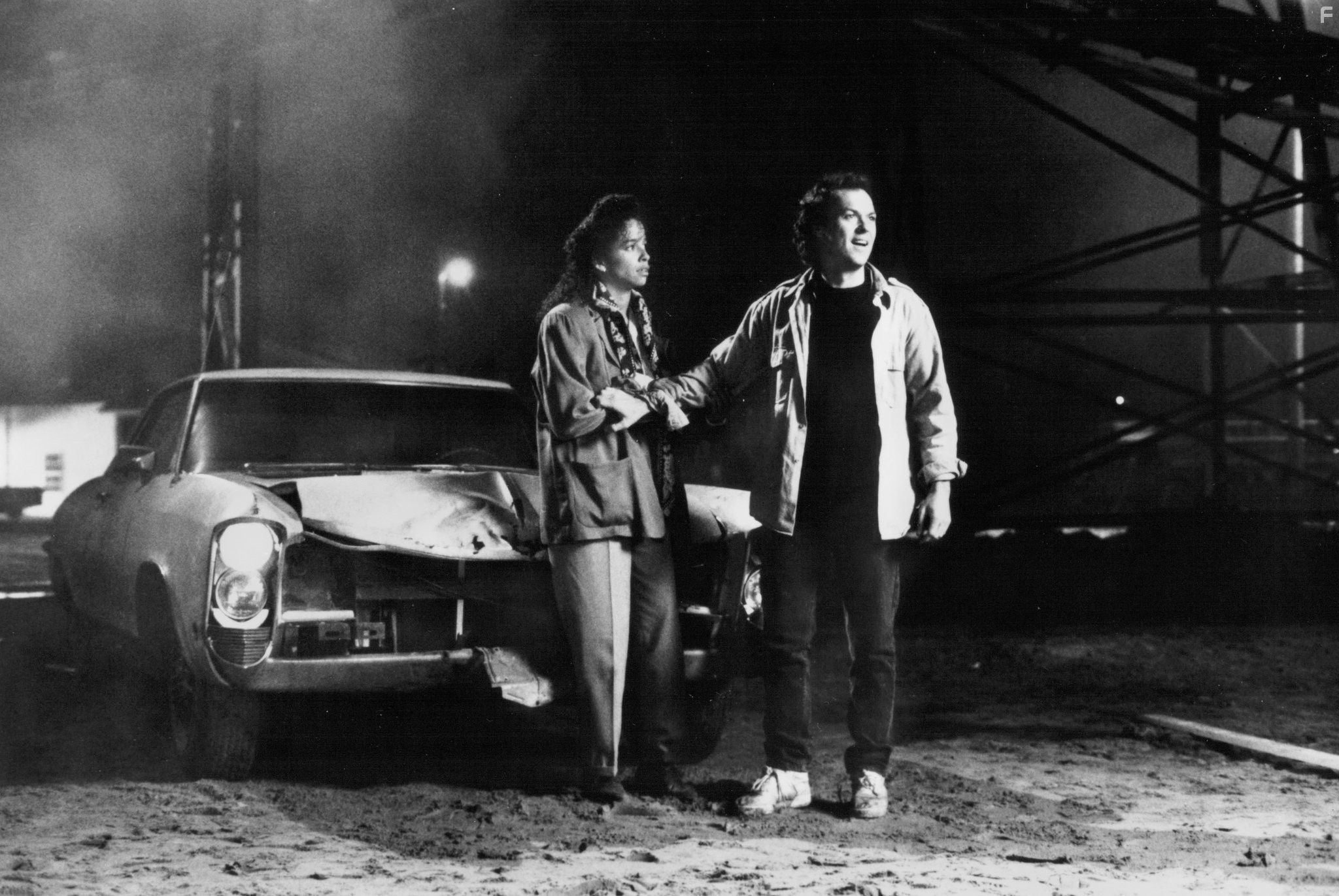 Michael Keaton and Rae Dawn Chong in The Squeeze (1987)