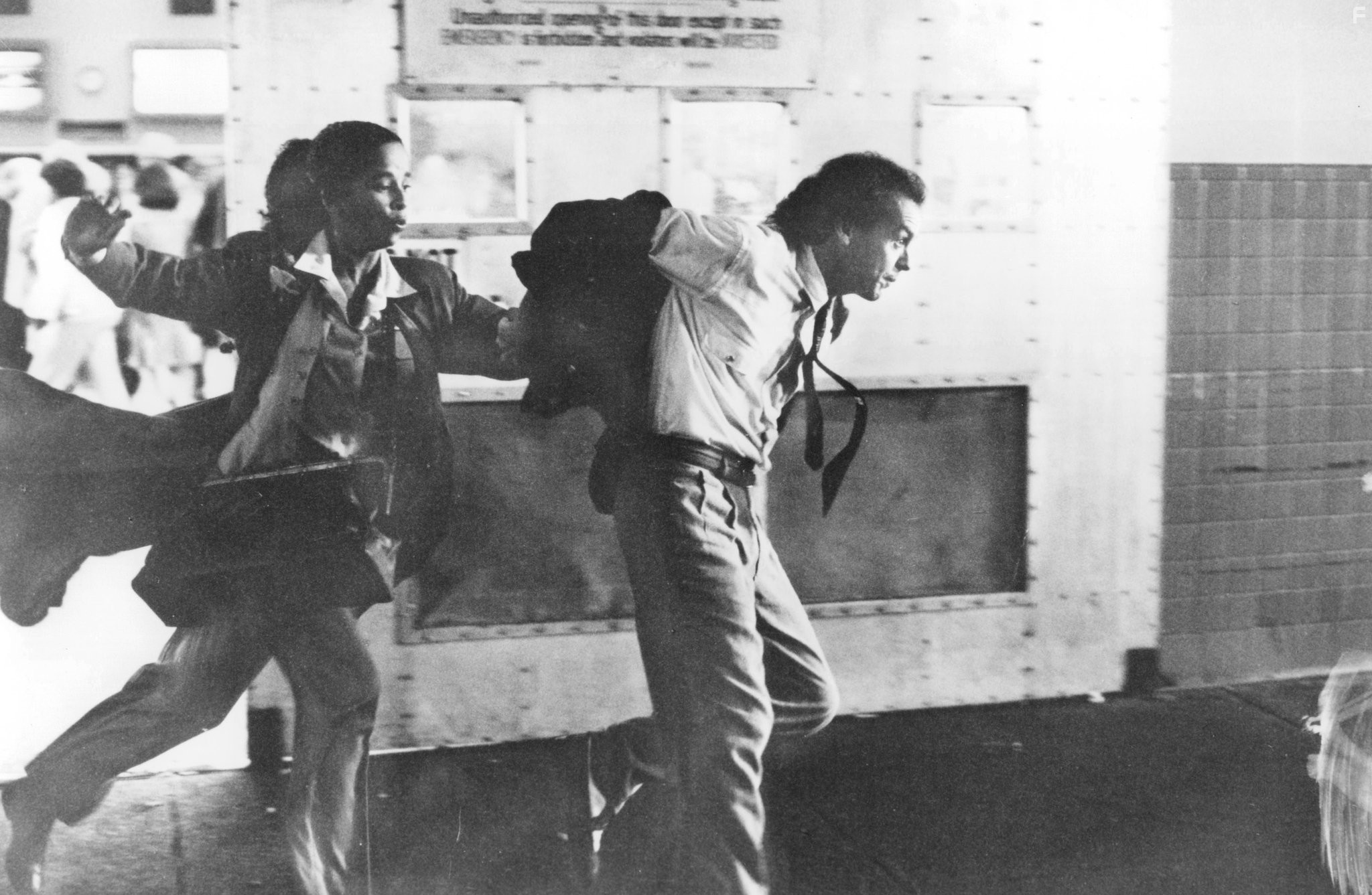 Michael Keaton and Rae Dawn Chong in The Squeeze (1987)