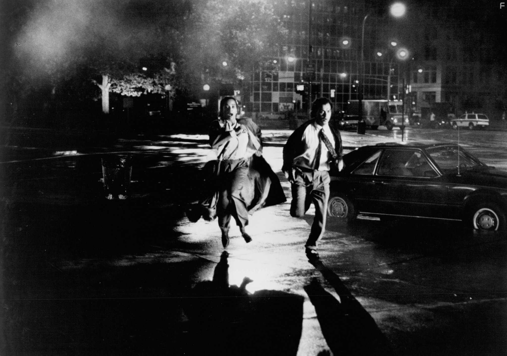 Michael Keaton and Rae Dawn Chong in The Squeeze (1987)