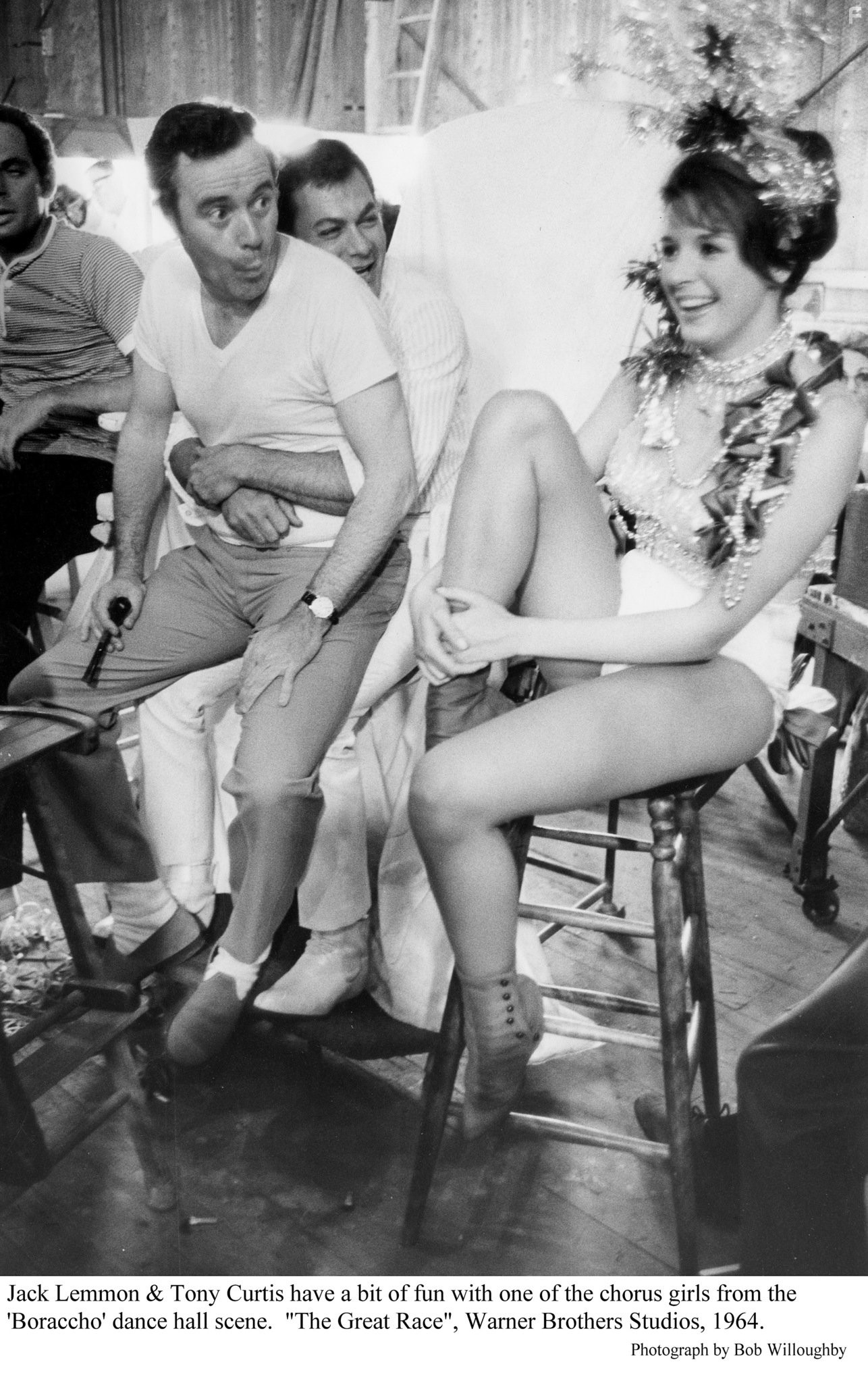"Great Race, The" Jack Lemmon  and Tony Curtis with one of the chorus girls. Photo taken in 1964 / Warner Bros.