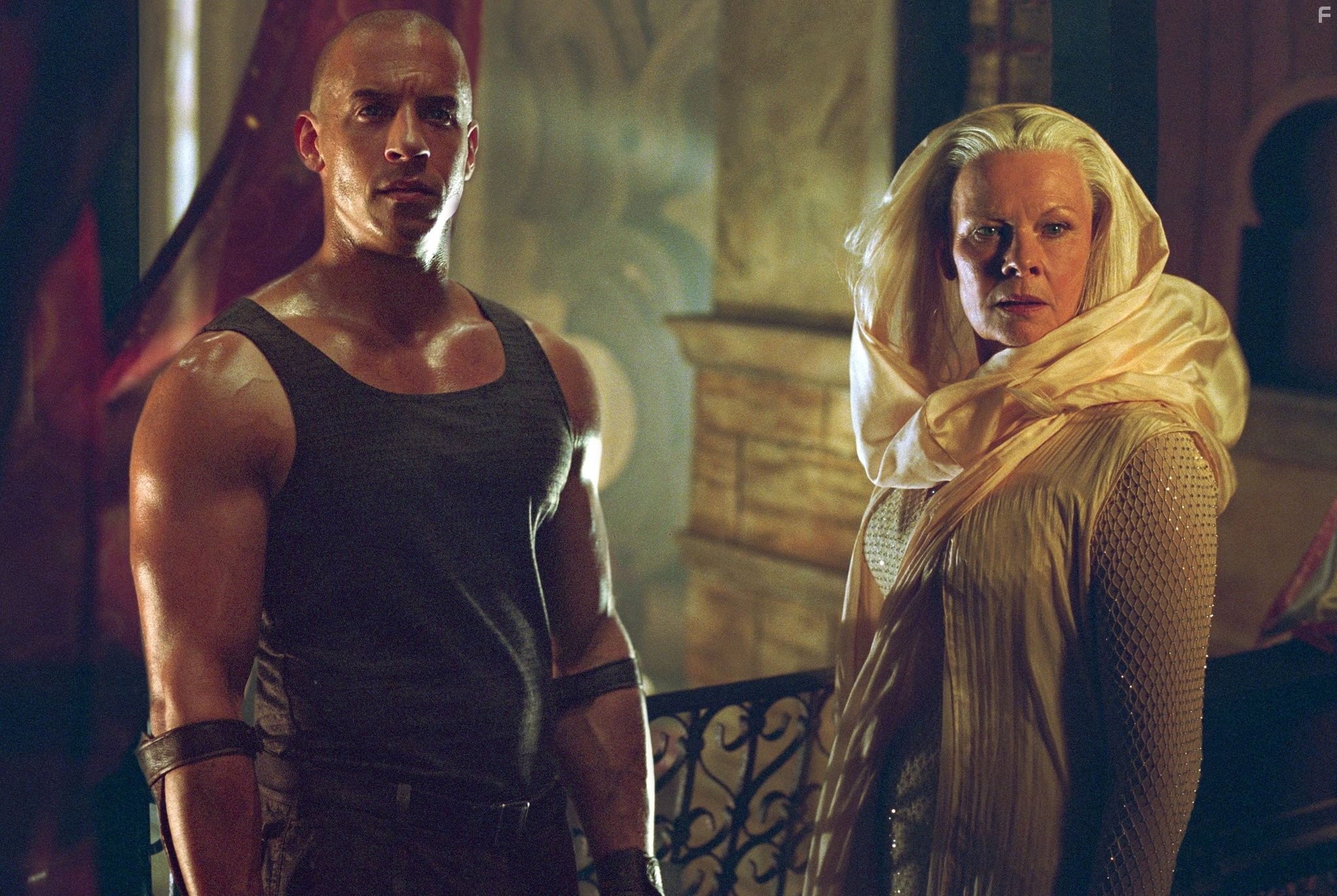 Judi Dench and Vin Diesel in Хроники Риддика (2004)