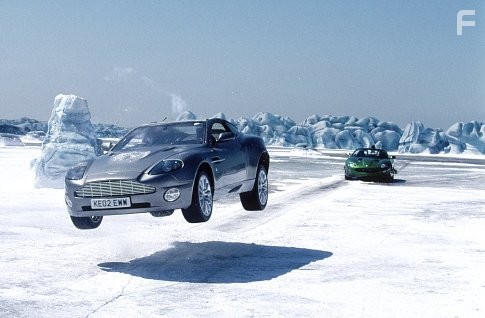 Bond's ASTON MARTIN V12 VANQUISH gets a jump on Zao's JAGUAR XKR.