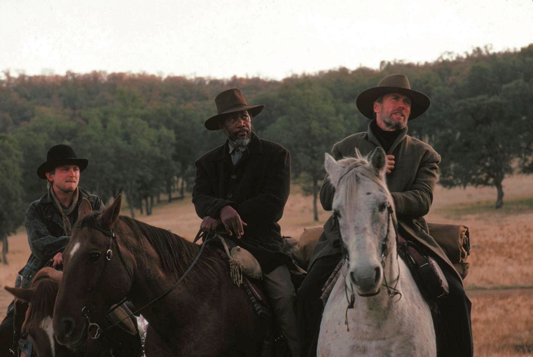 Clint Eastwood, Morgan Freeman, and Jaimz Woolvett in Непрощённый (1992)