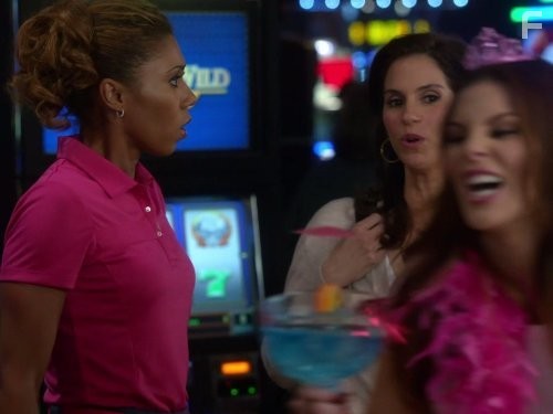 Jami Gertz and Toks Olagundoye in Соседи (2012)