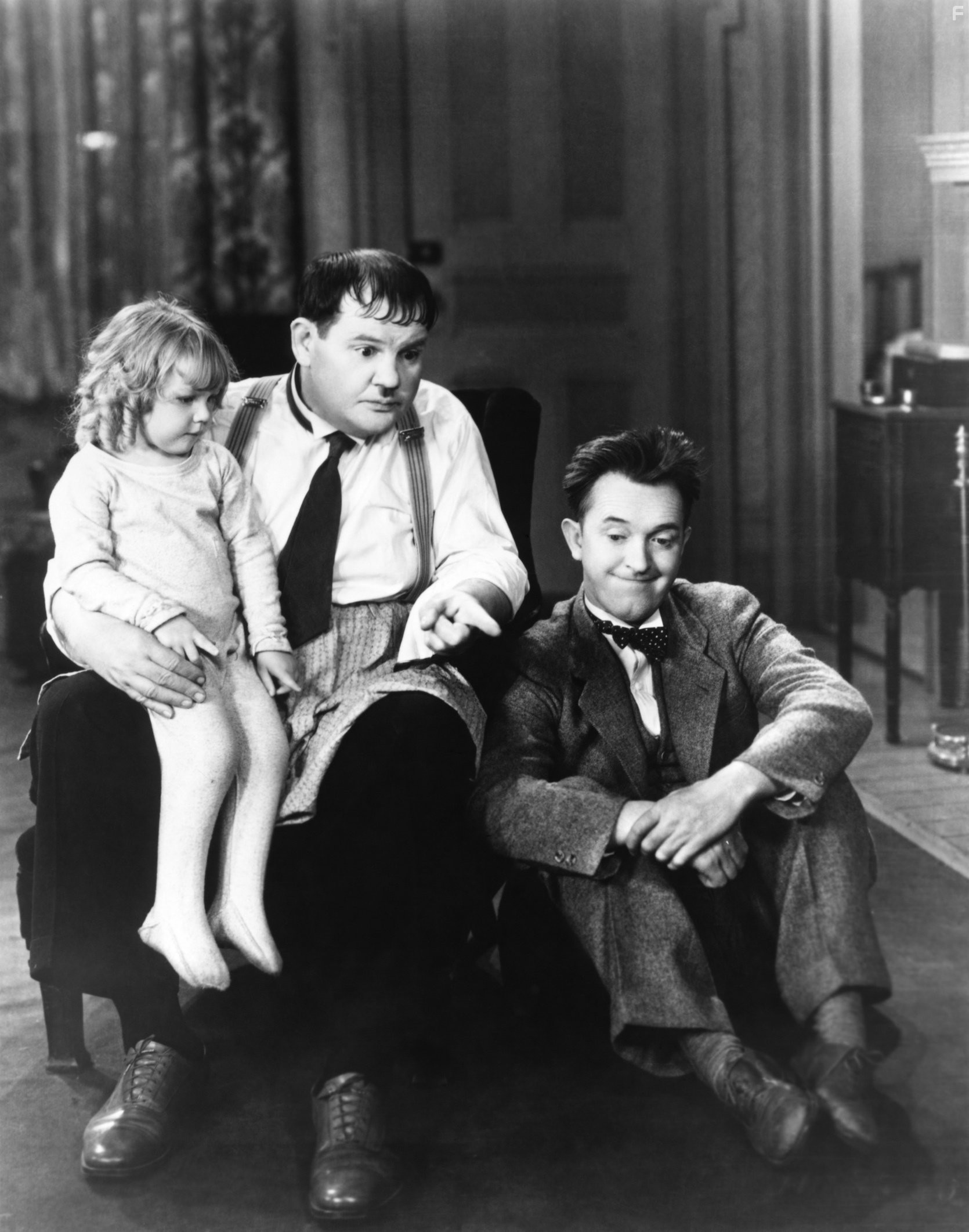 Oliver Hardy, Stan Laurel, and Jackie Lyn Dufton in Pack Up Your Troubles (1932)
