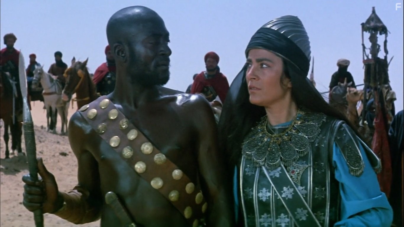 Salem Gedara and Irene Papas in Послание (1976)
