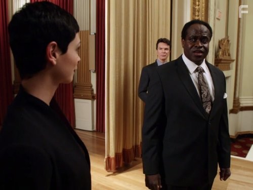 Christopher Shyer and Morena Baccarin in Vизитeры (2009)