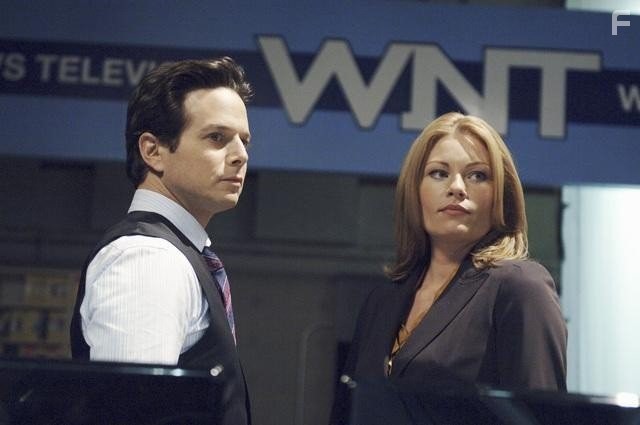 Ona Grauer and Scott Wolf in Vизитeры (2009)