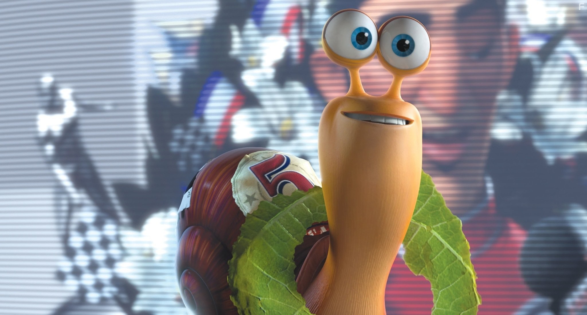 Turbo (voiced by Ryan Reynolds) basks in the televised image of his idol, race car driver Guy Gagne.