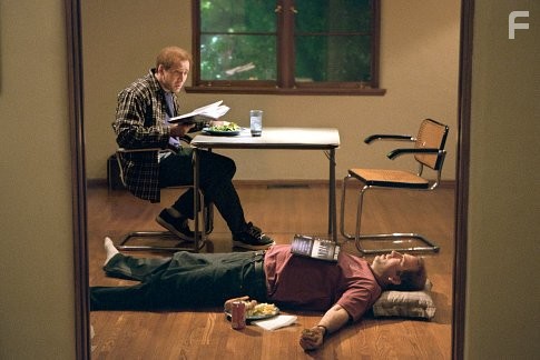 Twin-brothers Charlie, left, and Donald Kaufman (both played by Nicolas Cage) discuss the finer points of screenwriting.