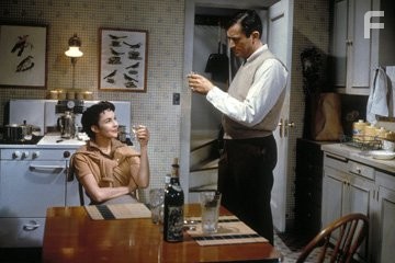 Человек в сером фланелевом костюме