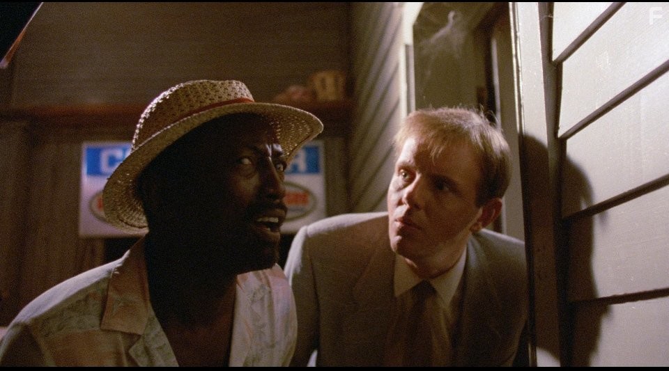 Michael Moriarty and Garrett Morris in Вкусная дрянь (1985)