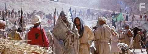 (Center left) Djimon Hounsou as Abou Fatma and (center right) Heath Ledger as Harry