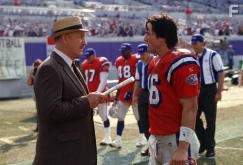Gene Hackman as Coach McGinty and Keanu Reeves as Shane Falso